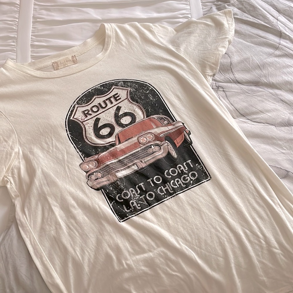I am selling a size small t-shirt from alter’d state. It is beige, pink, black